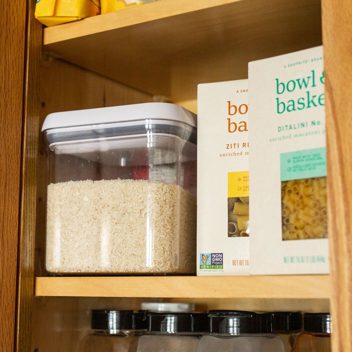 white rice and pasta in cabinet