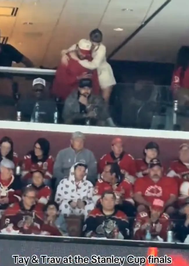 Travis Kelce and Taylor Swift hugging Stanley Cup final