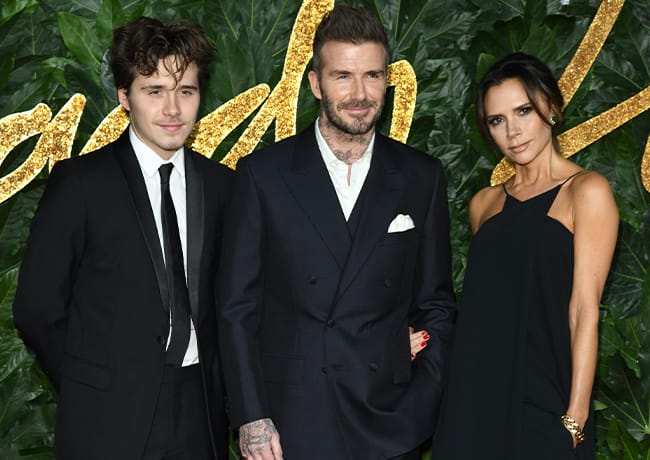 David Beckham and Victoria Beckham with Brooklyn Beckham at The Fashion Awards