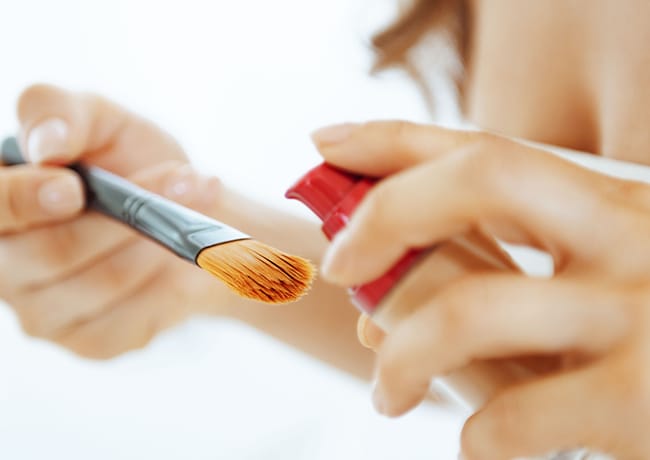 putting-foundation-on-brush