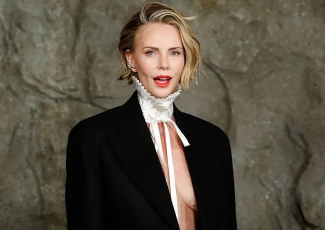 Charlize Theron Apex premiere Dior suit and collar