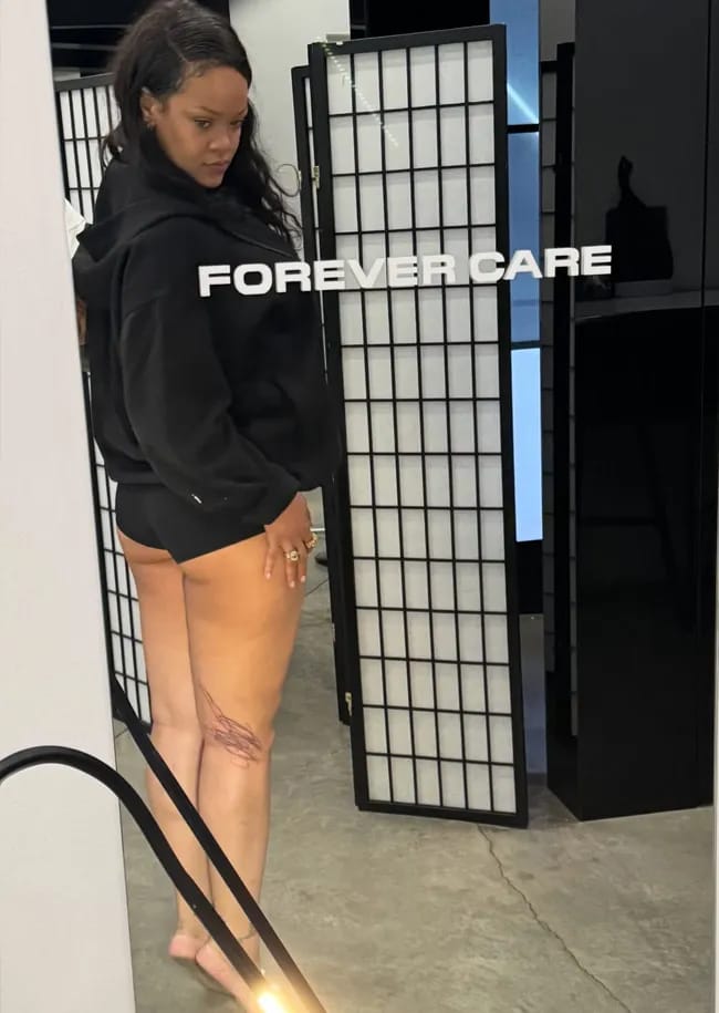 Rihanna showing off tattoo designed by her babies