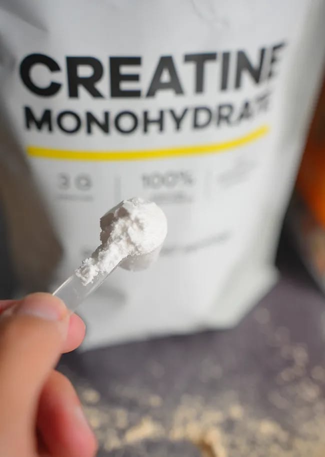 Scoop of creatine monohydrate for fitness and muscle growth.