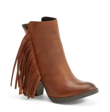 Steve Madden 'Woodstck' Fringe Bootie Stylish footwear from Steven showcased in an appealing fashion layout.