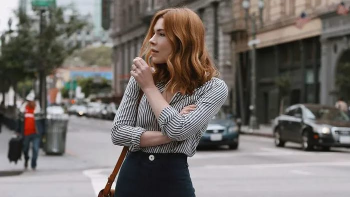 "Redhead woman showcasing colors that suit her"