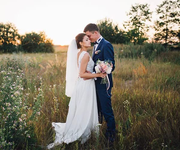 Picking The Wrong Time Bride and groom at sunset