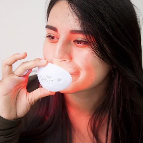 Revive LED lip plumper device for fuller lips.
