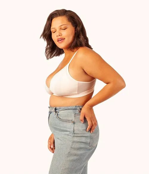 Soft pink busty bralette model front view.