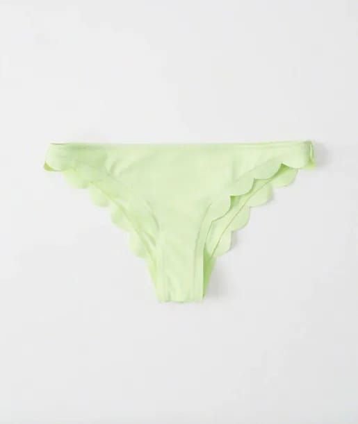 Fun scallop cheeky bikini bottom for poolside lounging.