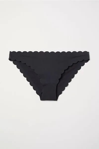 Stylish scalloped bikini bottom for summer beachwear.