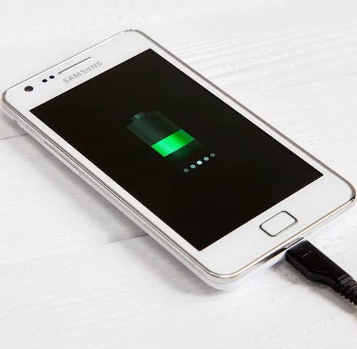 Charging an Android phone with a power adapter.