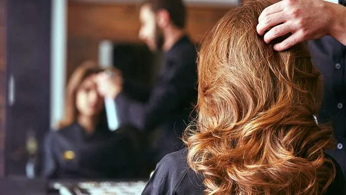 Woman getting her hair cut.