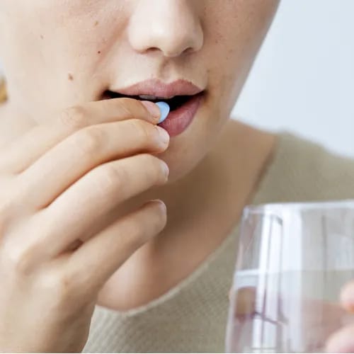 woman taking vitamin