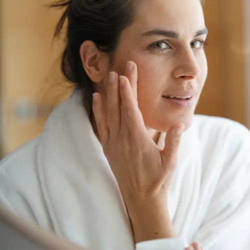 woman touching face