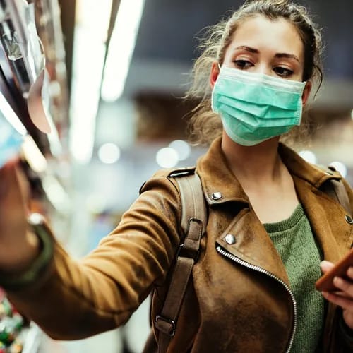 woman in mask shopping