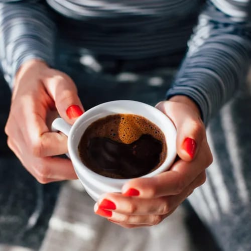 woman holding coffee