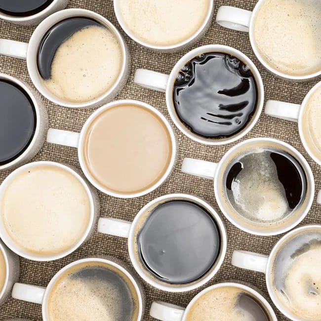 Coffee creamer pouring into a cup