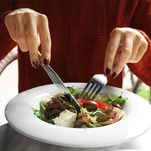 woman having salad