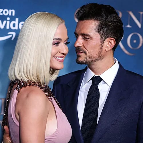 Katy Perry and Orlando Bloom sharing a sweet moment together.
