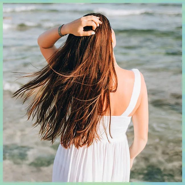 Woman with long, healthy hair flowing naturally.