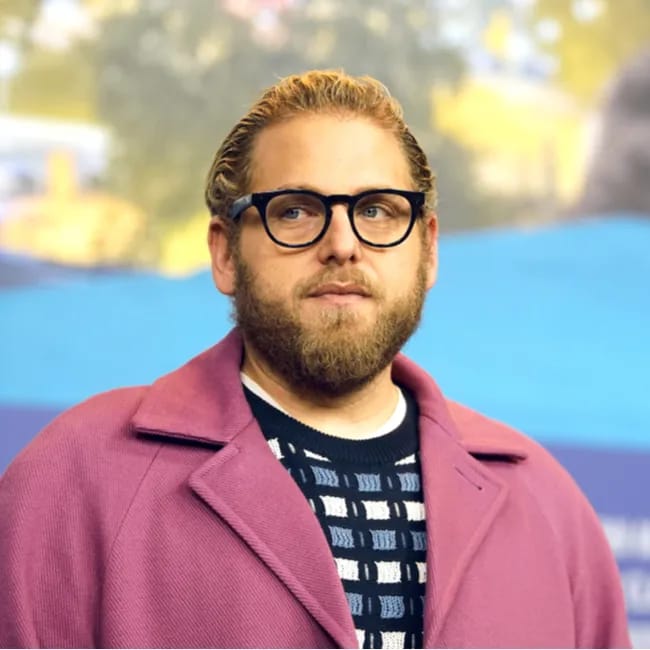 Jonah Hill wearing a purple jacket