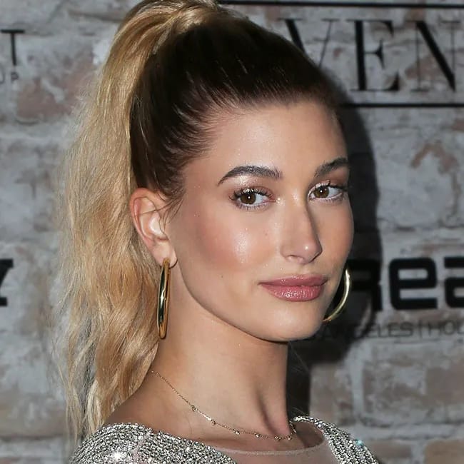 Hailey Bieber captured in a fashionable moment, radiating confidence.