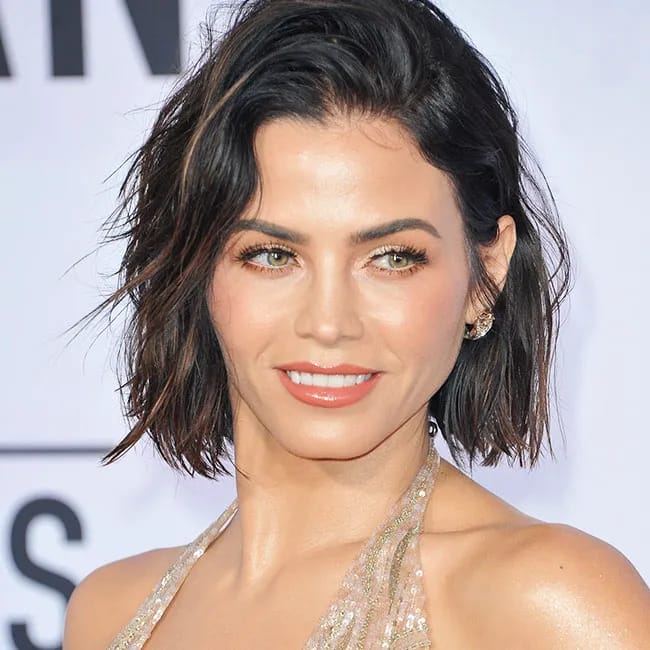 Jenna Dewan at a public event smiling confidently.