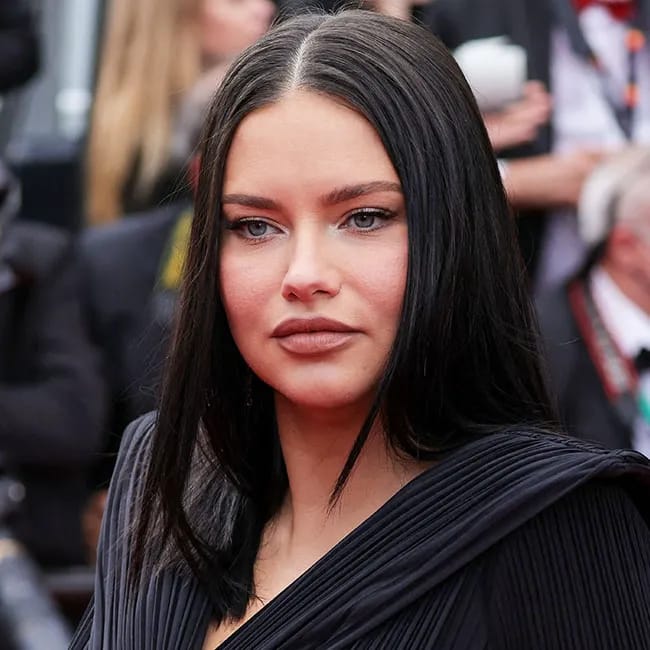 "Adriana Lima on the Cannes red carpet showcasing her baby bump"