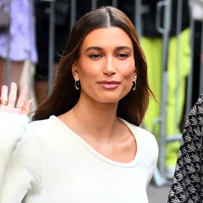 Hailey Bieber captures a candid moment, highlighting her chic style.