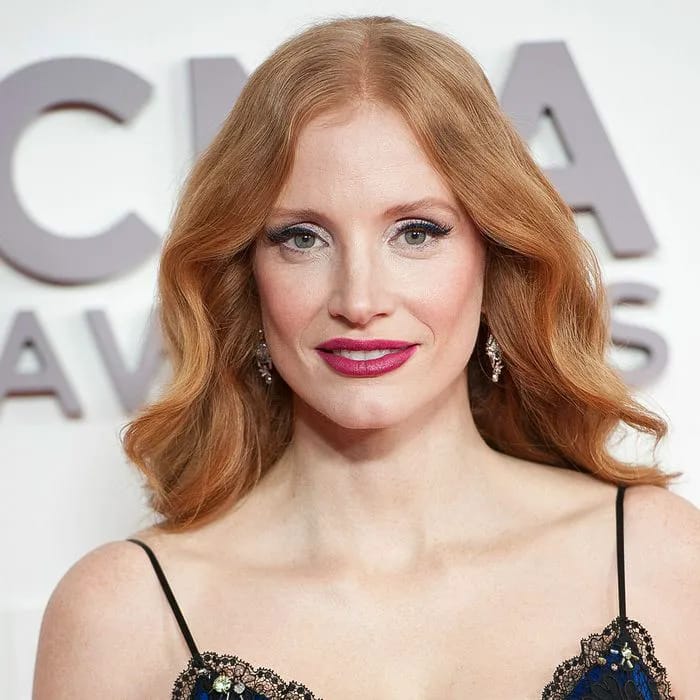 "Jessica Chastain smiling at an event"