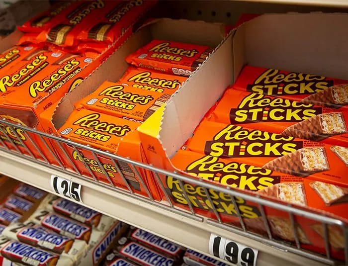 Chocolate candy bars in a shelf