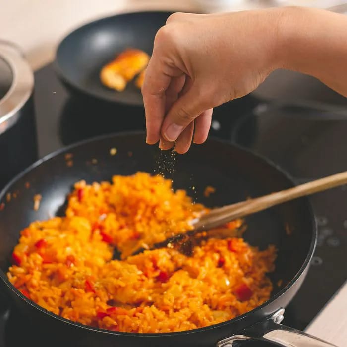 "Cooking dinner with various spices"
