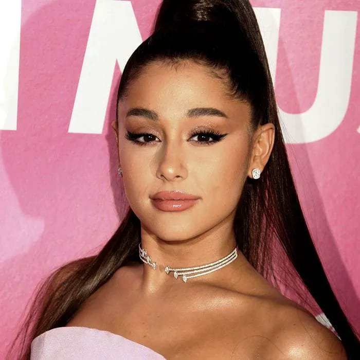 Ariana Grande striking a playful pose for the camera.