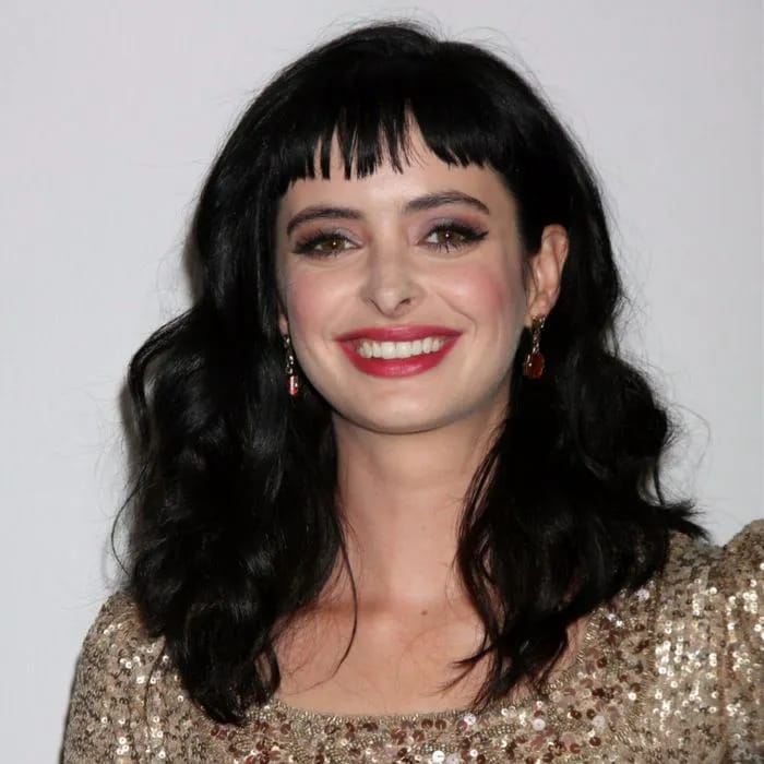 krysten ritter black hair baby bangs red carpet sparkly top red lipstick