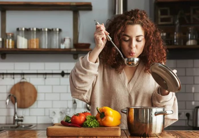 Woman making soup.