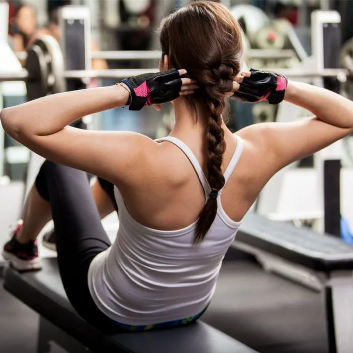 Woman doing crunches for core strength training.