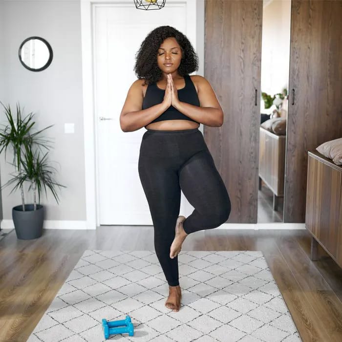 Woman practicing yoga for relaxation and flexibility.