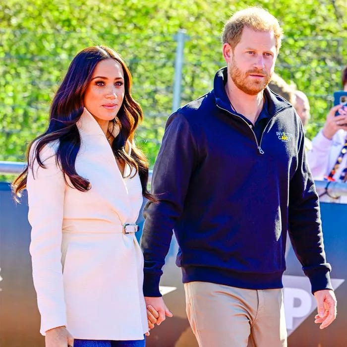 Meghan Markle and Prince Harry smiling together.