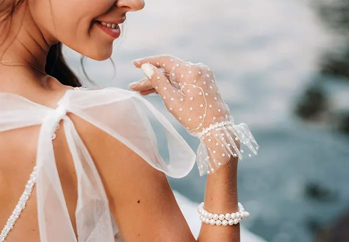 Bridal Gloves Bride wearing sheer wedding gloves
