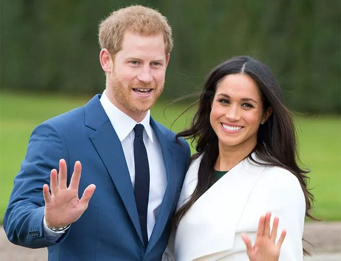 Prince Harry and Meghan Markle waving