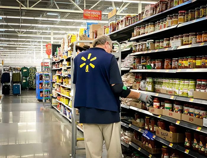 Walmart employee in aisle