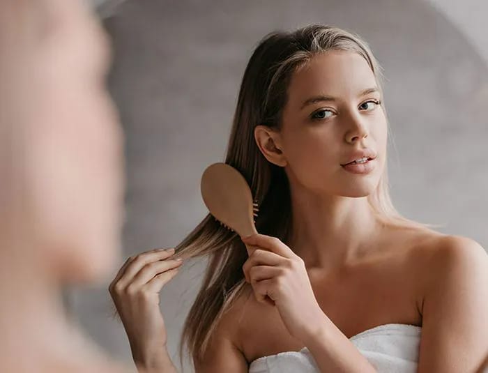 woman-brushing-long-hair