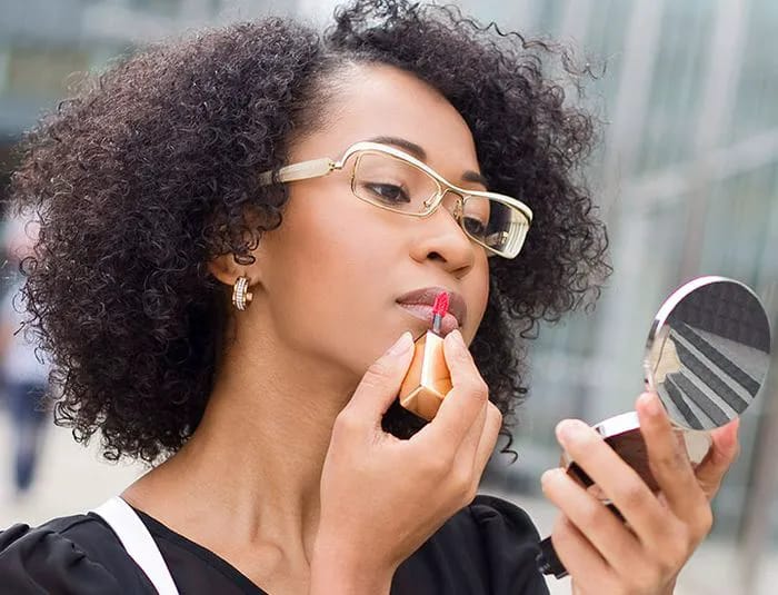 woman-applying-lipstick