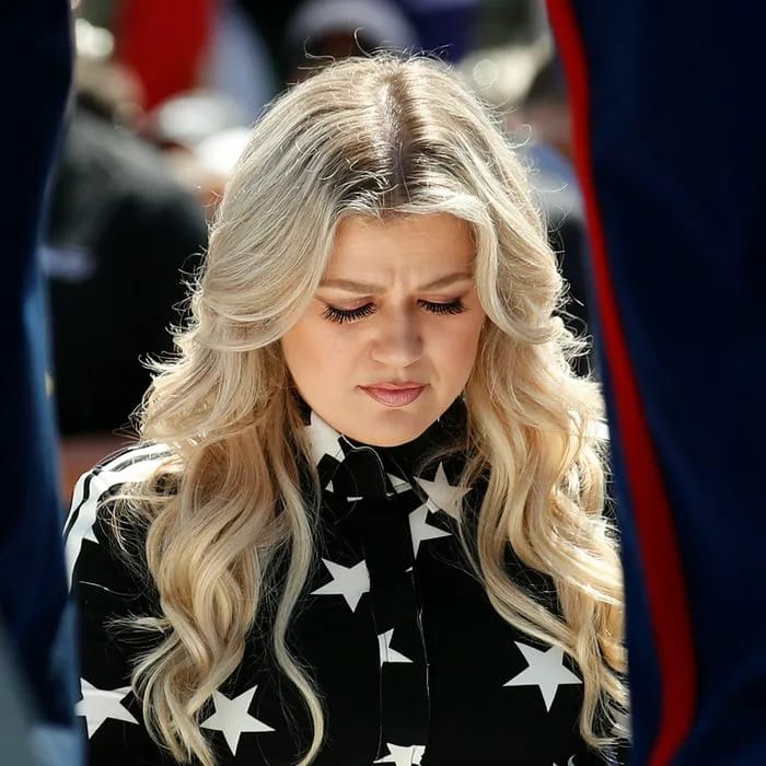 Kelly Clarkson looking solemn at the Indianapolis 500 auto race event.