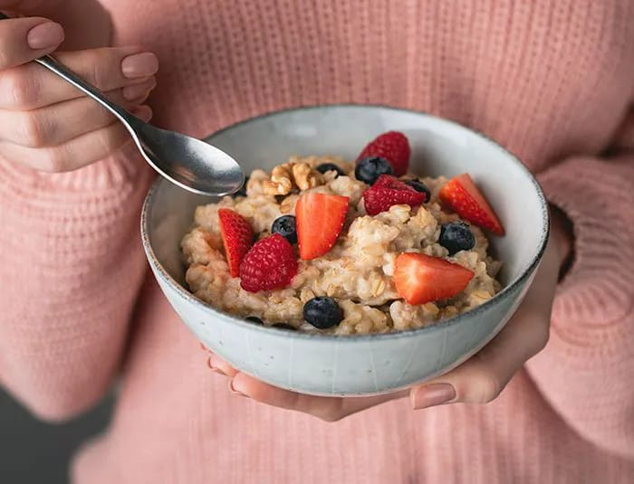 woman-eating-bowl-oatmeal