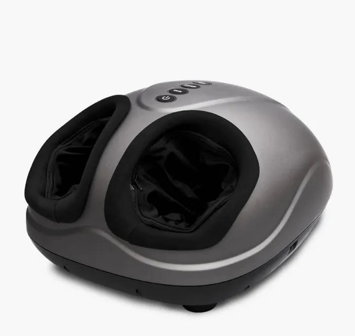 Woman enjoying a foot massage with Breo device