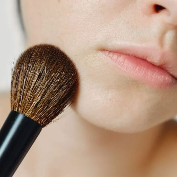 makeup-brush-touching-chin