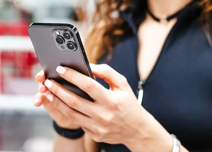 woman-texting-black-iphone