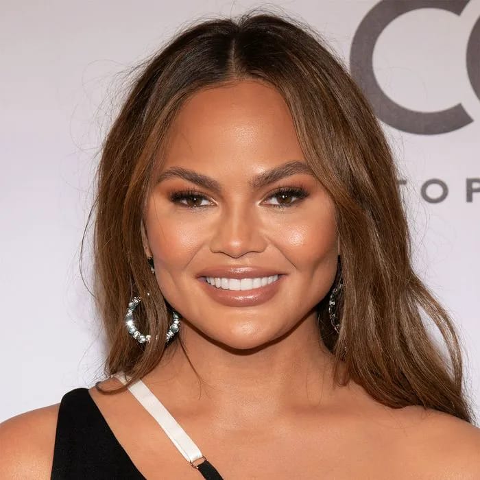 "Chrissy Teigen in a pink cone bra mini dress on Jimmy Kimmel Live"