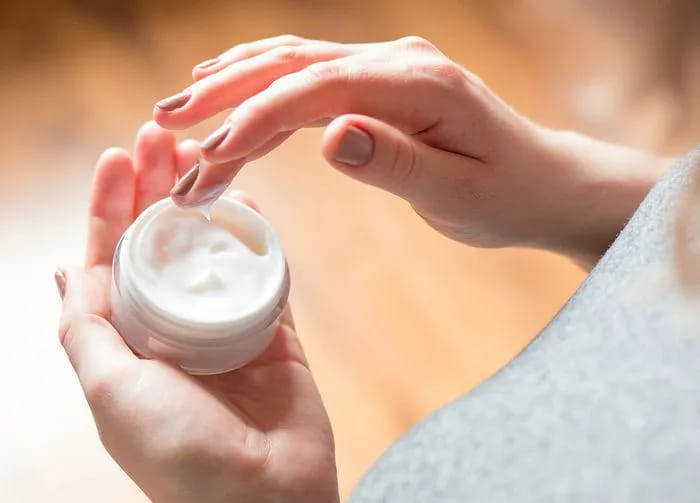 woman-using-body-cream